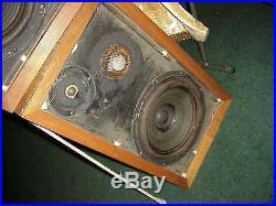 AR-3a vintage speakers with grills and paperwork on back of speakers